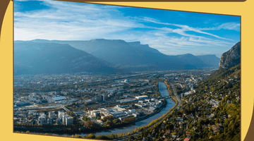 Aerial view of Grenoble and announcement that Grenoble won a prestigious award