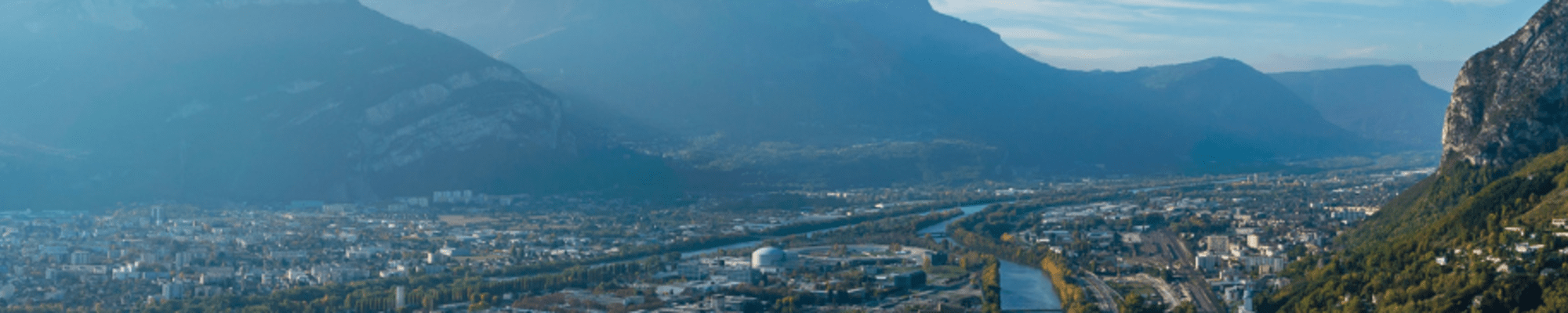 Aerial view of Grenoble and announcement that Grenoble won a prestigious award
